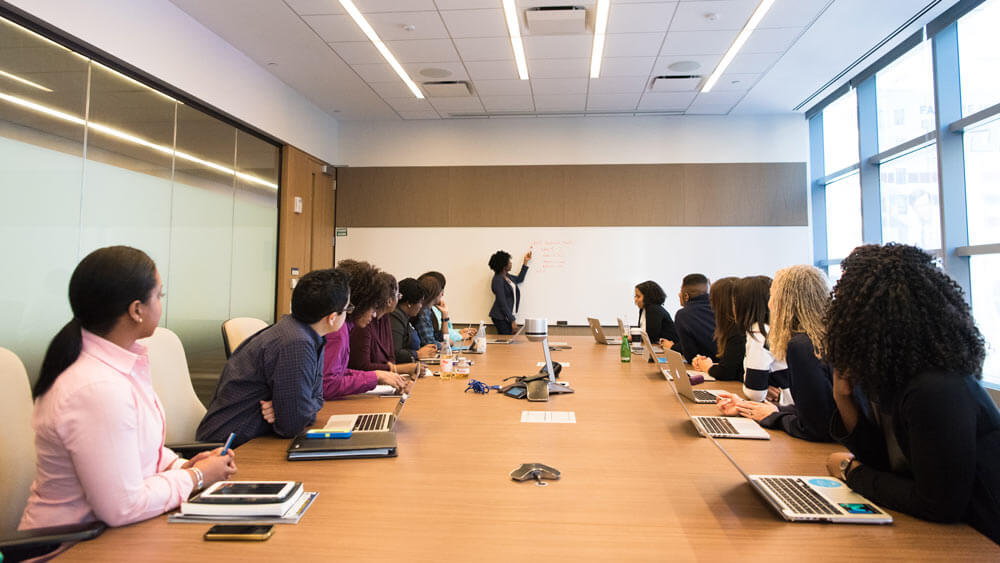 A meeting room with many participants.